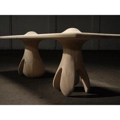 two wooden benches sitting on top of a floor