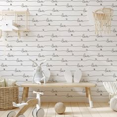 a child's room with white and black wallpaper