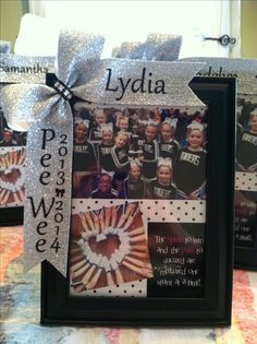 a photo frame decorated with cheerleaders and ribbons