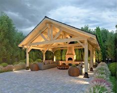 an outdoor living area with fireplace, couches and fire pit in the middle of it