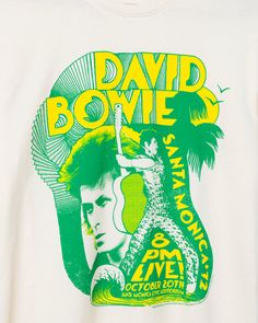 Step into the spotlight with our David Bowie Santa Monica '72 Vintage Tee! Capturing the essence of Bowie's iconic performance, this tee exudes retro glam and rock 'n' roll charm. With vintage-inspired graphics and legendary appeal, it's a must-have for any fan looking to channel Ziggy Stardust's timeless style. Shop the rest of our David Bowie Collection HERE and Shop the rest of our Music Collection HERE. Retro Glam, Music Collection, Ziggy Stardust, Vintage Tee, David Bowie, Rock N, Santa Monica, Stardust, Vintage Tees