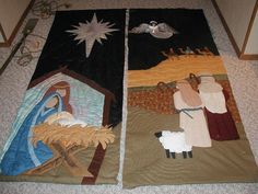 two quilted nativity scenes on the floor