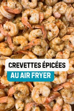 the words crevettes epices au air fryer are in front of a pile of shrimp