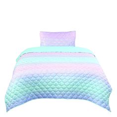 a bed with a blue, pink and green bedspread