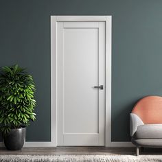 an empty room with a chair, potted plant and white door in the corner