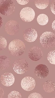 a pink and gold polka dot wallpaper with lots of dots on the surface in different shades