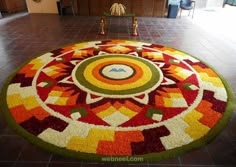 a large colorful rug in the middle of a room