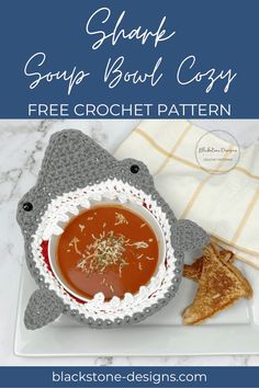 a bowl of soup and some chips on a plate with the title shark soup bowl cozy