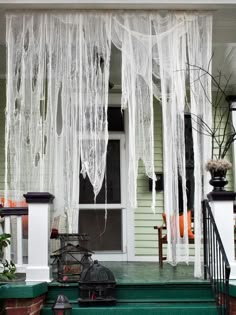 a porch decorated for halloween with white icing