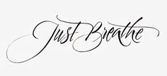 the word just breathe written in cursive writing