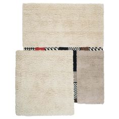 two rugs with different designs on them, one is white and the other is beige