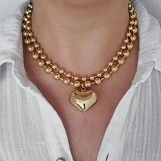 "This eye-catching statement necklace has a large puffy heart pendant on a thick gold filled ball chain. The whole piece is made of 18K gold filled brass, which looks almost like 18K solid gold. You can mix and match this necklace with your other gold or gold plated necklaces for a chic look.  This necklace can be sold separately or as a set with another 6 mm plain ball chain. The two chains complement each other and create a layered effect. The set is also available for purchase. MATERIALS: - 1 Chunky Heart-shaped Gold Jewelry, Chunky Heart Shaped Gold Jewelry, Gold Chunky Heart-shaped Jewelry, Chunky Heart-shaped Gold Necklace, Chunky Heart Pendant Necklace For Valentine's Day, Chunky Heart Necklace For Valentine's Day, Gold Chunky Heart Necklace, Chunky Gold Heart Necklace, Gold Ball Chain