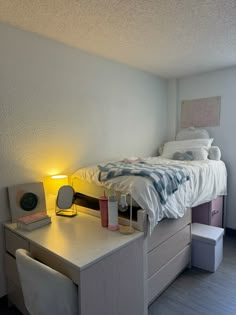 a bedroom with a bed and desk in it