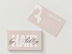 two business cards with the word hair written in cursive writing on them, one is pink and white