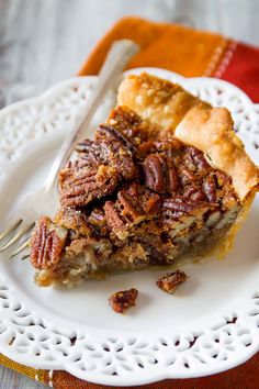 a slice of pecan pie on a white plate