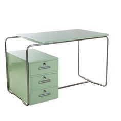 a green desk with three drawers on it