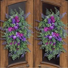 two wooden doors with purple flowers and greenery on the front, and green leaves on the back