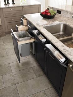 a kitchen with an open sink and dishwasher