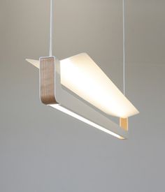 a modern light fixture hanging from the ceiling