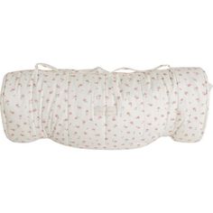 a roll of white and pink fabric with small flowers on the front, sitting on a white background