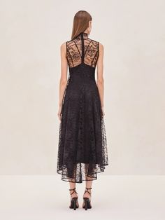 Meet the Rhiane Lace Midi Dress—a blend of elegance and edge that's designed to turn heads. This piece is all about versatility. Wear it with the slip for a more classic, refined look, or without if you're feeling daring. The intricate lace detailing adds a touch of romance, while the sheer fabric keeps things modern and unexpected. Whether you're dressing up for an event or just want to make a statement, Rhiane is your perfect go-to. Elegant Spring Evening Dress With Lace Trim, Elegant Evening Dress With Lace Trim For Spring, Formal Midi Dress With Delicate Lace, Evening Midi Dress With Delicate Lace, Delicate Lace Sleeveless Gala Dress, Delicate Lace Midi Dress For Formal Occasions, Elegant Midi Dress With Delicate Lace For Party, Elegant Sheer Midi Dress For Gala, Elegant Party Midi Dress With Delicate Lace