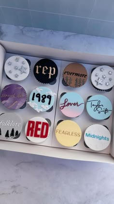 an open box filled with lots of different types of buttons