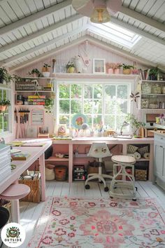 a room filled with lots of clutter and furniture next to a large open window