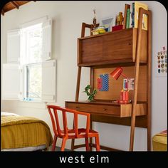 a bed room with a neatly made bed and a wooden shelf next to the bed