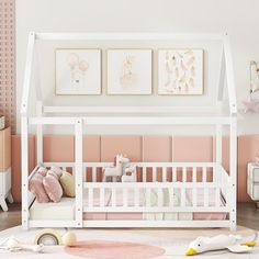 a baby's room with pink walls and white furniture