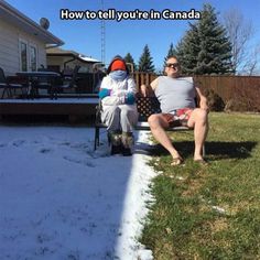 two people are sitting on a bench in the snow and one person is wearing sunglasses