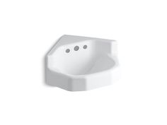 a white bathroom sink sitting on top of a wall