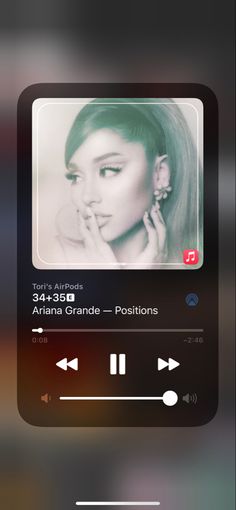 the music player is playing an album on her cell phone, and it's also showing