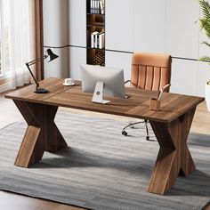 an office desk with a computer on it in front of a bookcase and potted plant