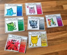 five cards with pictures of different animals and words in them on a wooden table top