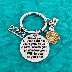 a keychain with a quote on it that says, behind you all your moms