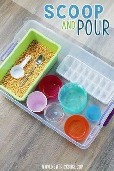 a plastic container with spoons and bowls in it