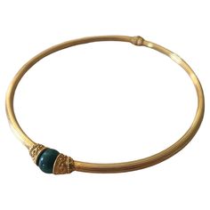 lias Lalaounis 18 Karat Gold Malachite Choker Necklace. This unique 8mm wide hinged choker features a single malachite bead set in one of the ends. Both ends of this choker and near the hinge contain gold bead, rope, and scroll designs. Stamped near the hinge is C12 750, Marker's Mark, GREECE MECAN. The inner circumference of the collar is 11,3 cm. The total gold weight of the necklace is 45 grams. Bead Rope, Vintage Choker Necklace, 18k Gold Bracelet, Vintage Choker, Bronze Necklace, Greek Revival, Bead Set, Gold Choker, Stone Cuts