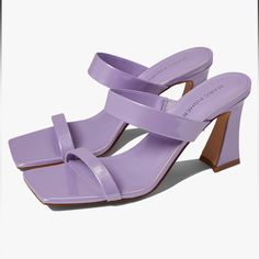 Stay On Trend In The Fashion Forward Marc Fisher Zasha Sandal. Slip On Style. Square Open Toe Silhouette. Padded Footbed Offers Lasting Comfort. Covered Block Heel. Man-Made Upper, Lining, Insole, And Outsole. Purple Block Heel Sandals In Synthetic Material, Purple Block Heel Sandals In Synthetic, Purple Synthetic Sandals With Block Heel, Purple Stacked Heel Heels For Spring, Spring Purple Heels With Stacked Heel, Spring Purple Open Toe Mules, Spring Season Purple Open Toe Mules, Summer Purple Mules, Purple Summer Mules