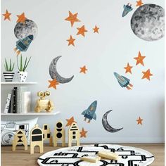 a room with stars and moon decals on the wall