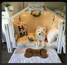 a dog is sitting in his bed with the word woof written on it's side