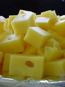 cubes of cheese are piled on top of each other