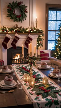 a christmas table setting with candles and plates