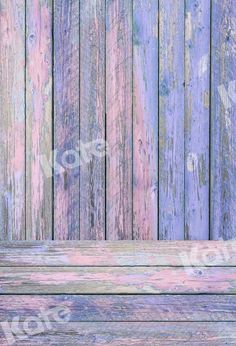 an old wooden bench with faded paint on it