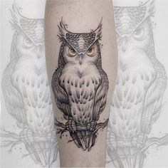 an owl tattoo on the leg