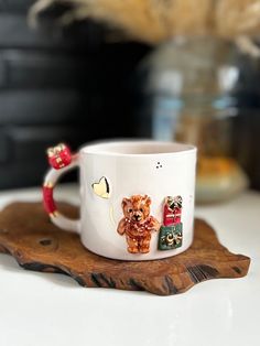 a white coffee cup sitting on top of a wooden tray