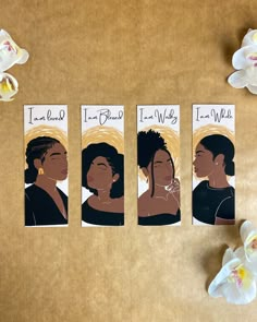 three bookmarks with black women's faces on them next to white orchids