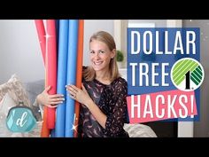 a woman standing next to two giant inflatable trees with the words dollar tree hacks