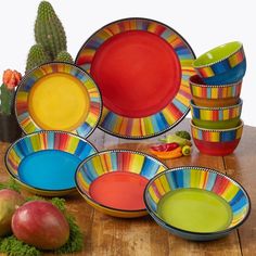 colorful plates and bowls on a wooden table