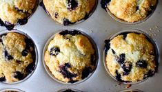 twelve blueberry muffins in the pan ready to be baked and eaten for breakfast