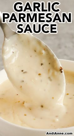 garlic parmesan sauce in a white bowl with a spoon full of gravy